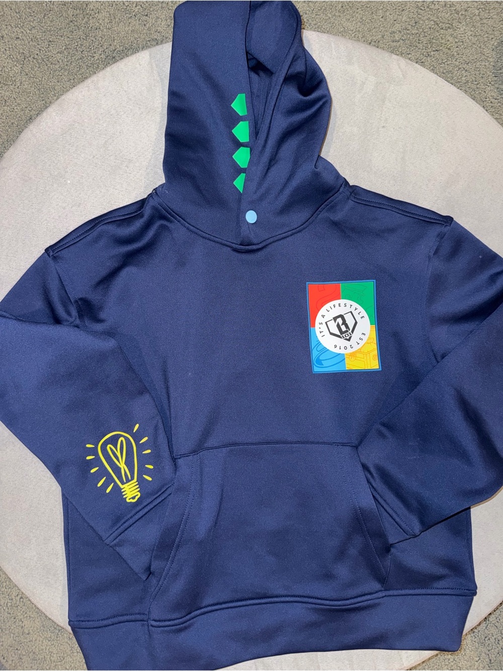 Kids Navy Hoodie with Color Block Logo and Yellow Lightbulb Graphic